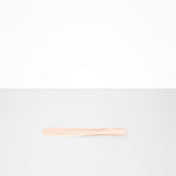 Dinosaur Designs Temple Cake Knife in Rose Swirl — handcrafted marbled dusty pink resin cake knife with smooth tapered blade and rounded handle.