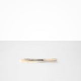 Dinosaur Designs Temple Cake Knife in Sandy Pearl — handcrafted marbled beige, grey and pearlescent resin cake knife with smooth tapered blade and rounded handle.