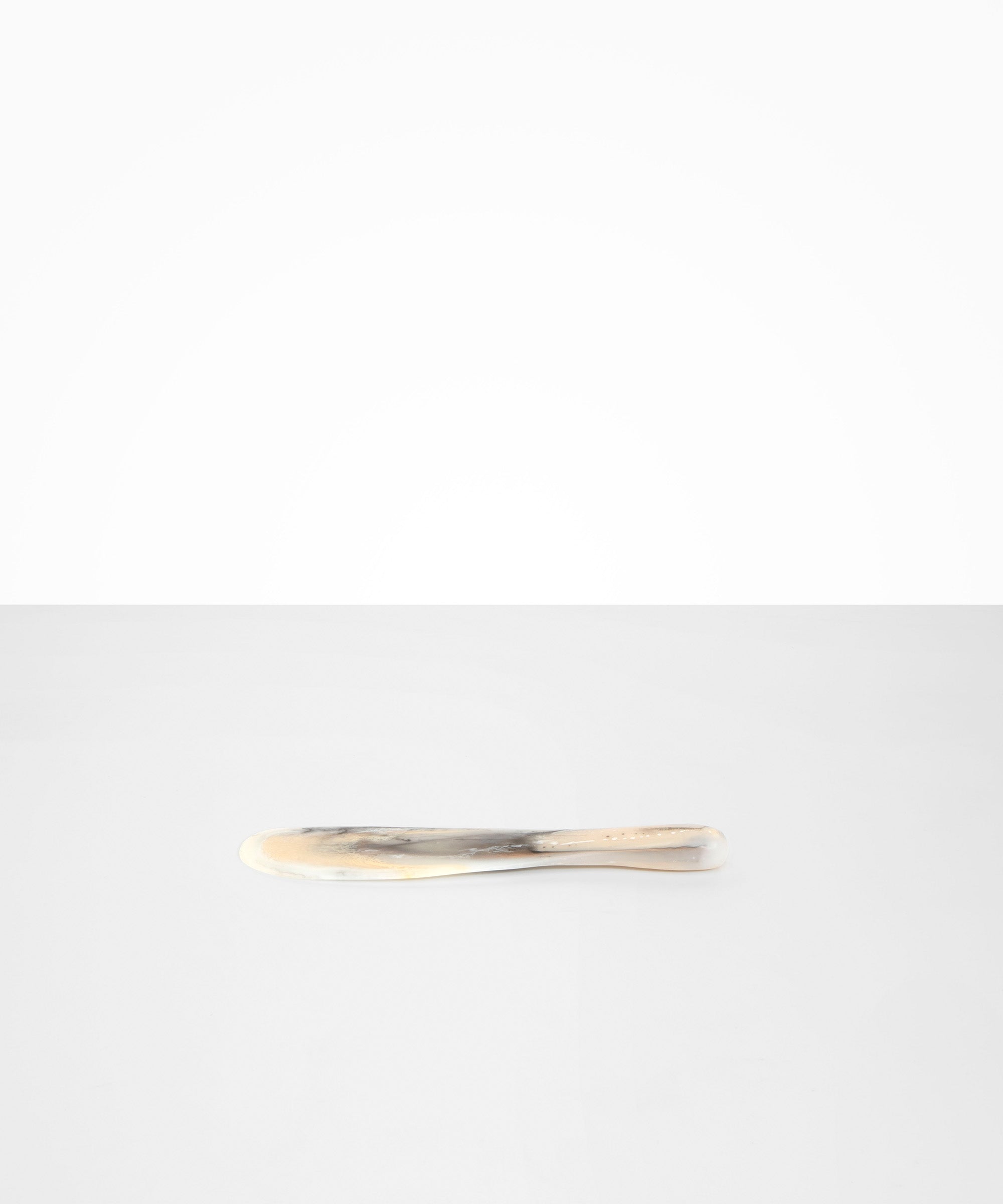 Dinosaur Designs Temple Cake Knife in Sandy Pearl — handcrafted marbled beige, grey and pearlescent resin cake knife with smooth tapered blade and rounded handle.