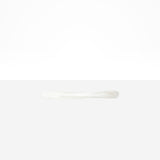 Dinosaur Designs Temple Cake Knife in Snow Swirl — handcrafted marbled white and clear resin cake knife with smooth tapered blade and rounded handle.