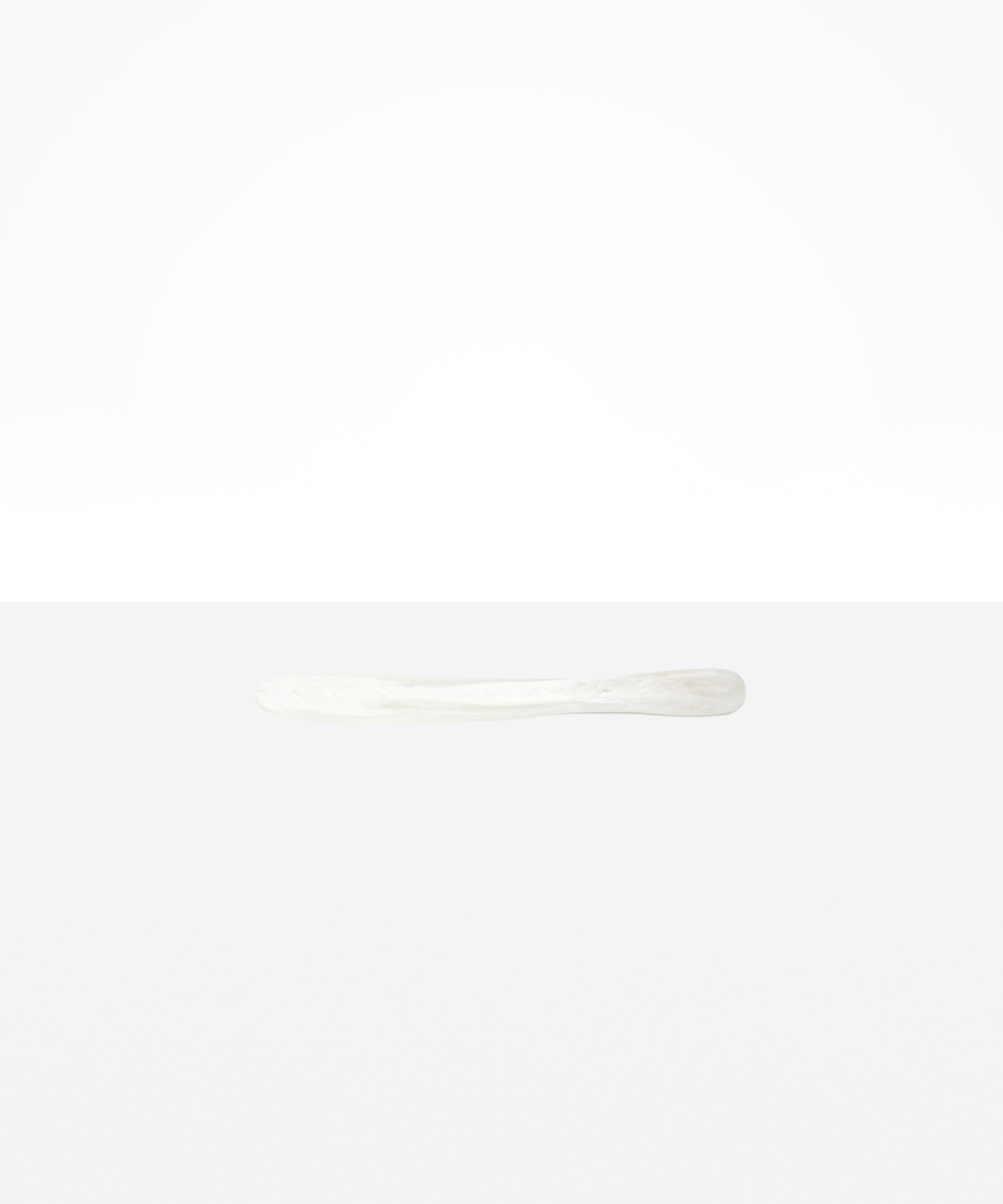 Dinosaur Designs Temple Cake Knife in Snow Swirl — handcrafted marbled white and clear resin cake knife with smooth tapered blade and rounded handle.