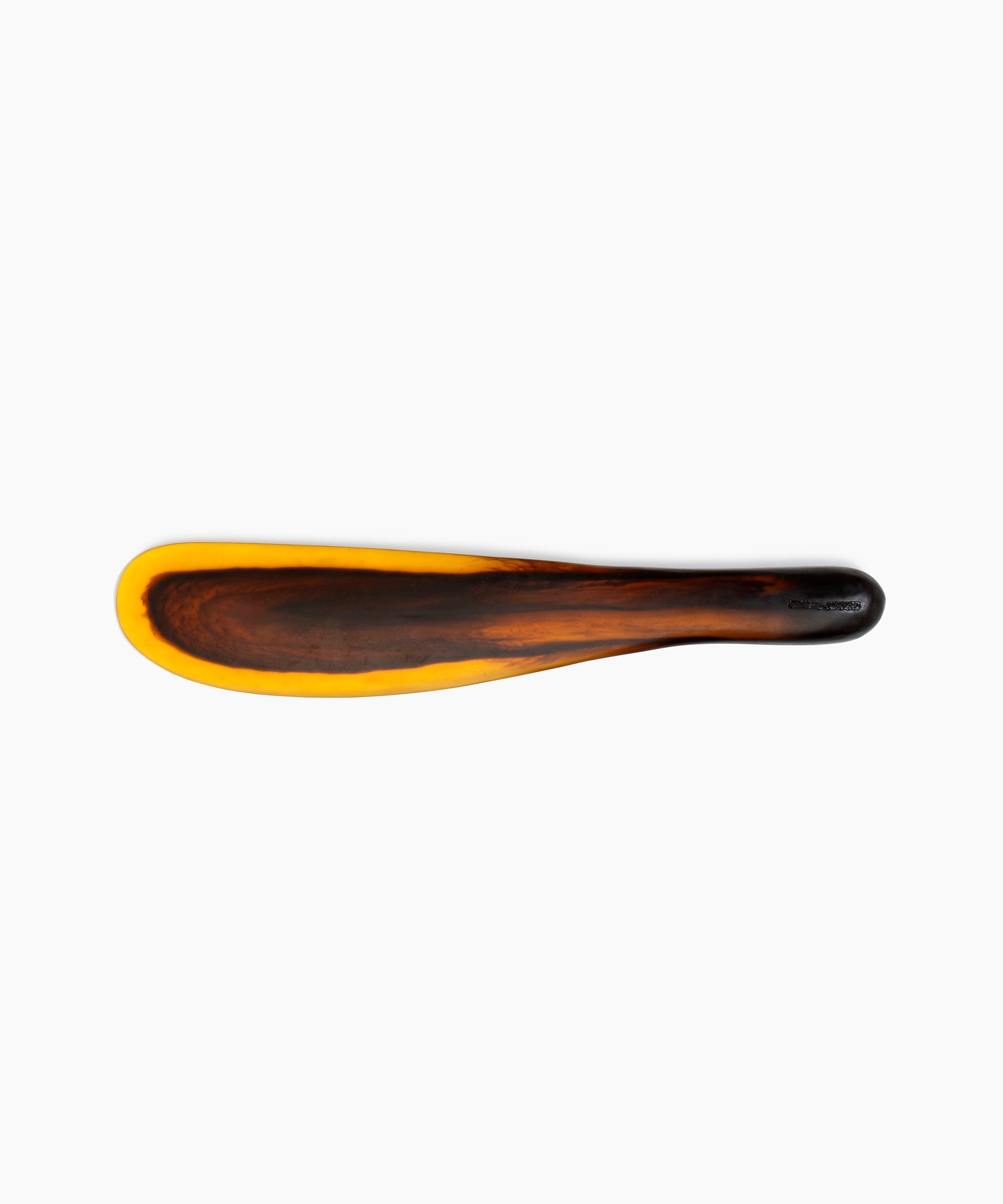 Dinosaur Designs Temple Cake Knife in Tortoise — handcrafted marbled amber and black resin cake knife with smooth tapered blade and rounded handle.