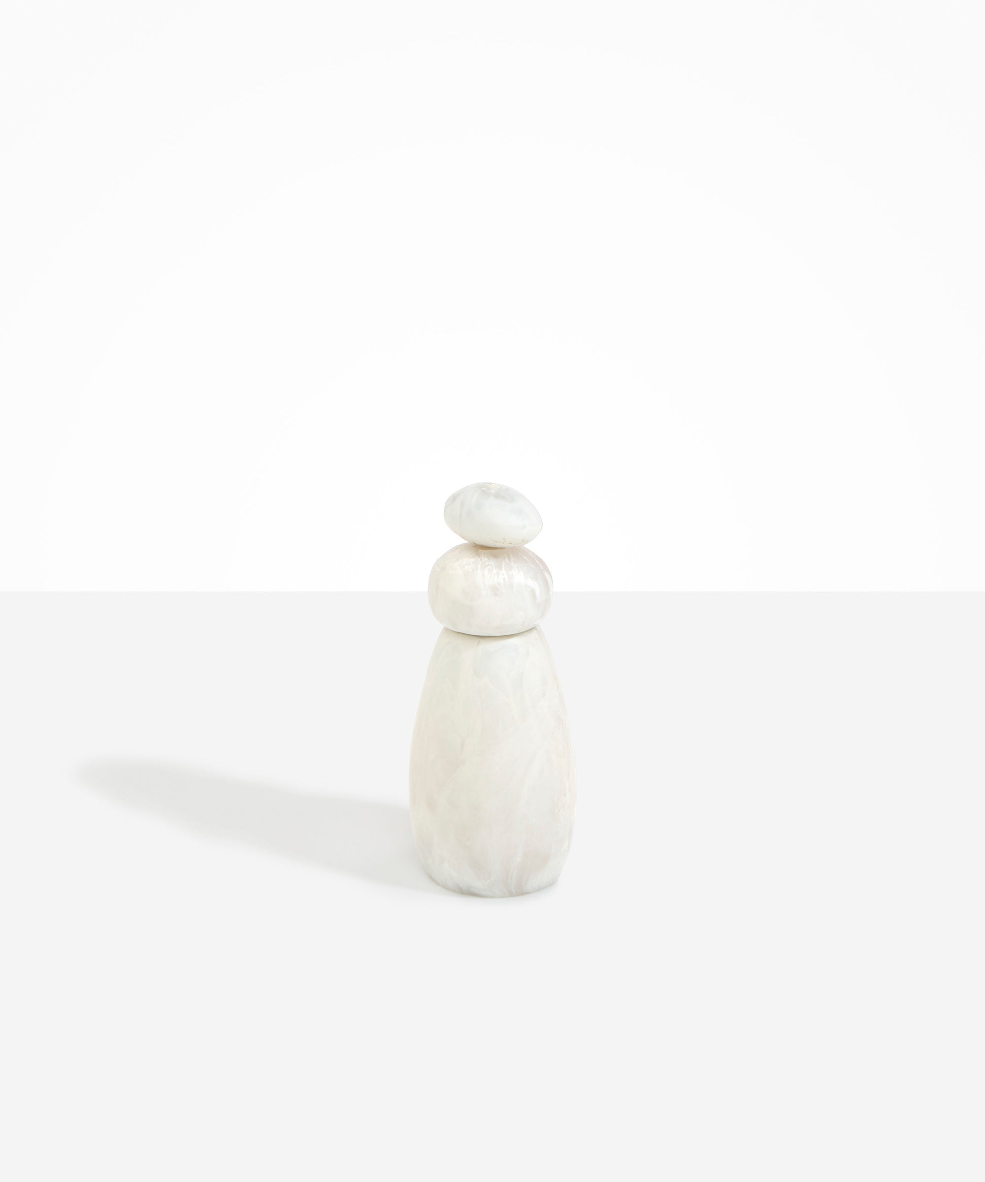 Dinosaur Designs Tall Pepper Boulder Grinder in Chalk Swirl — handcrafted marbled off-white resin pepper grinder with elongated teardrop body and stacked pebble lid