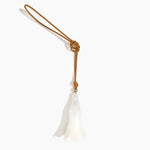 Dinosaur Designs Long Flower Bag Charm in Chalk Swirl colour with Brass bead — handcrafted marbled off-white resin bell-shaped flower bag charm with tan leather hanging loop and brass bead