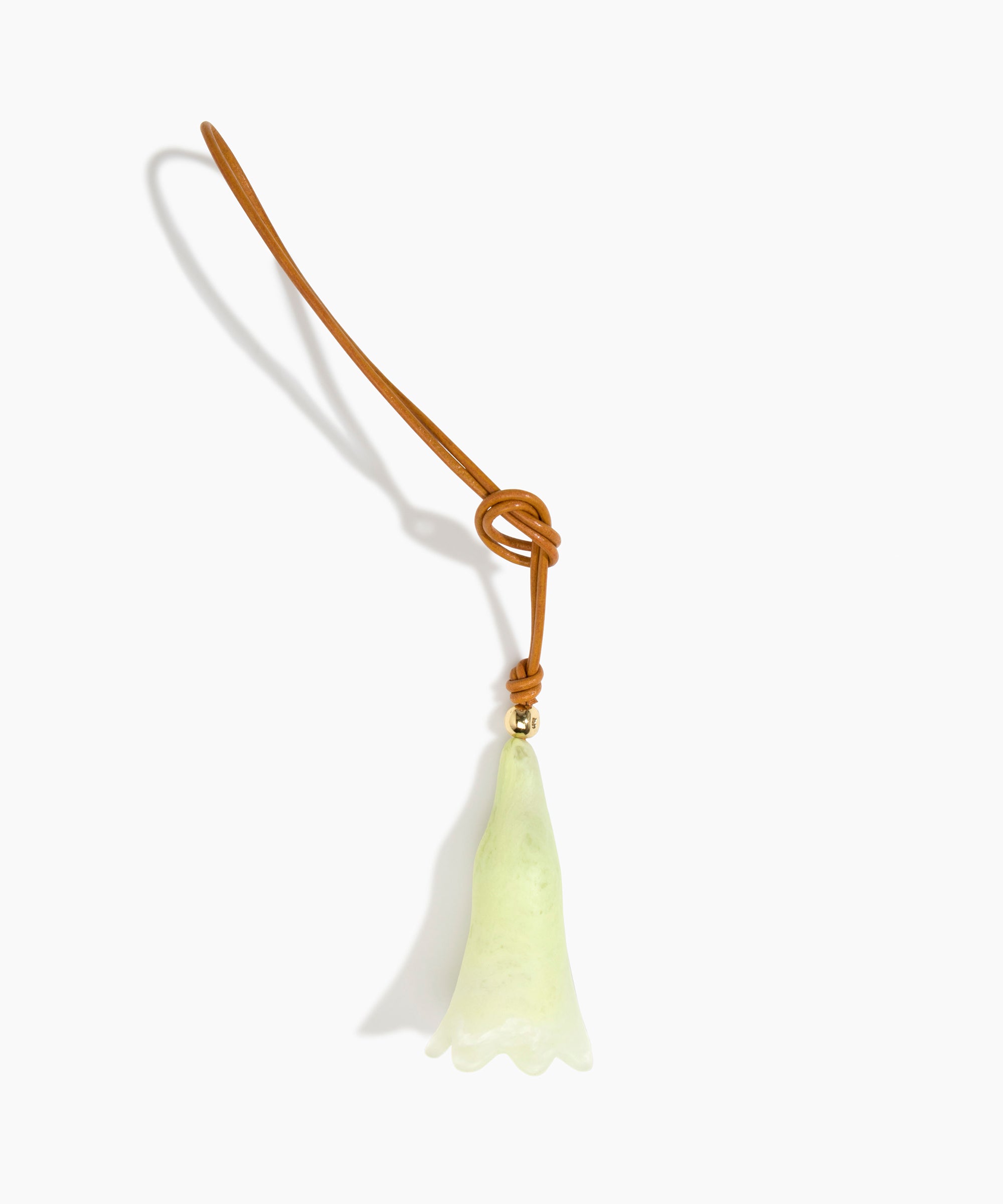 Dinosaur Designs Long Flower Bag Charm in Pistachio colour with Brass bead — handcrafted marbled pastel green resin bell-shaped flower bag charm with tan leather hanging loop and brass bead