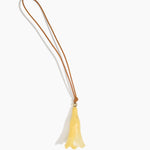 Dinosaur Designs Long Flower Bag Charm in Pollen colour with Brass bead — handcrafted marbled yellow resin bell-shaped flower bag charm with tan leather hanging loop and brass bead