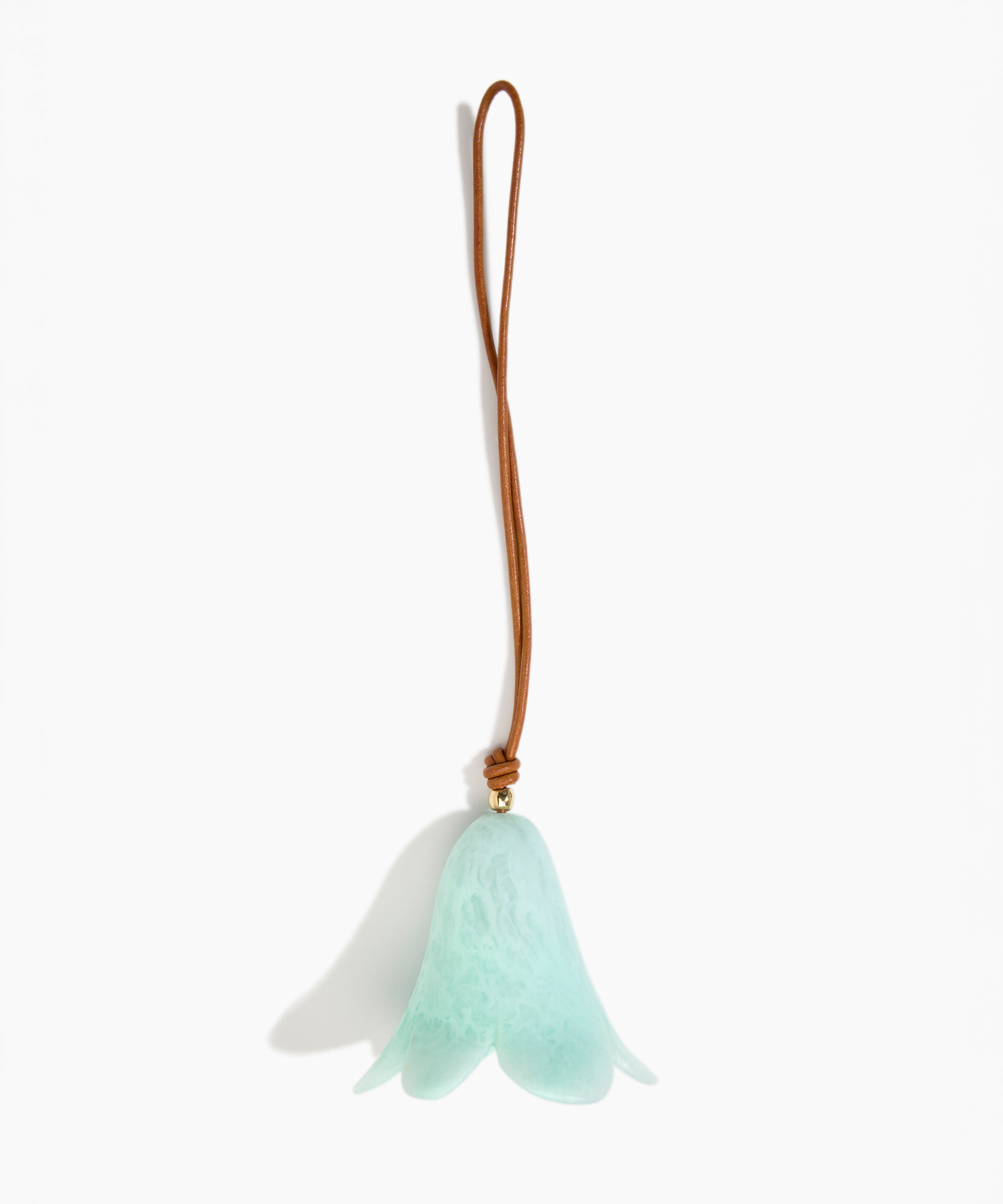 Dinosaur Designs Flower Decoration in Mint colour with Brass bead — handcrafted marbled mint blue resin bell-shaped flower ornament with tan leather hanging loop and brass bead