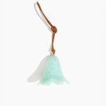 Dinosaur Designs Flower Decoration in Mint colour with Brass bead — handcrafted marbled mint blue resin bell-shaped flower ornament with tan leather hanging loop and brass bead