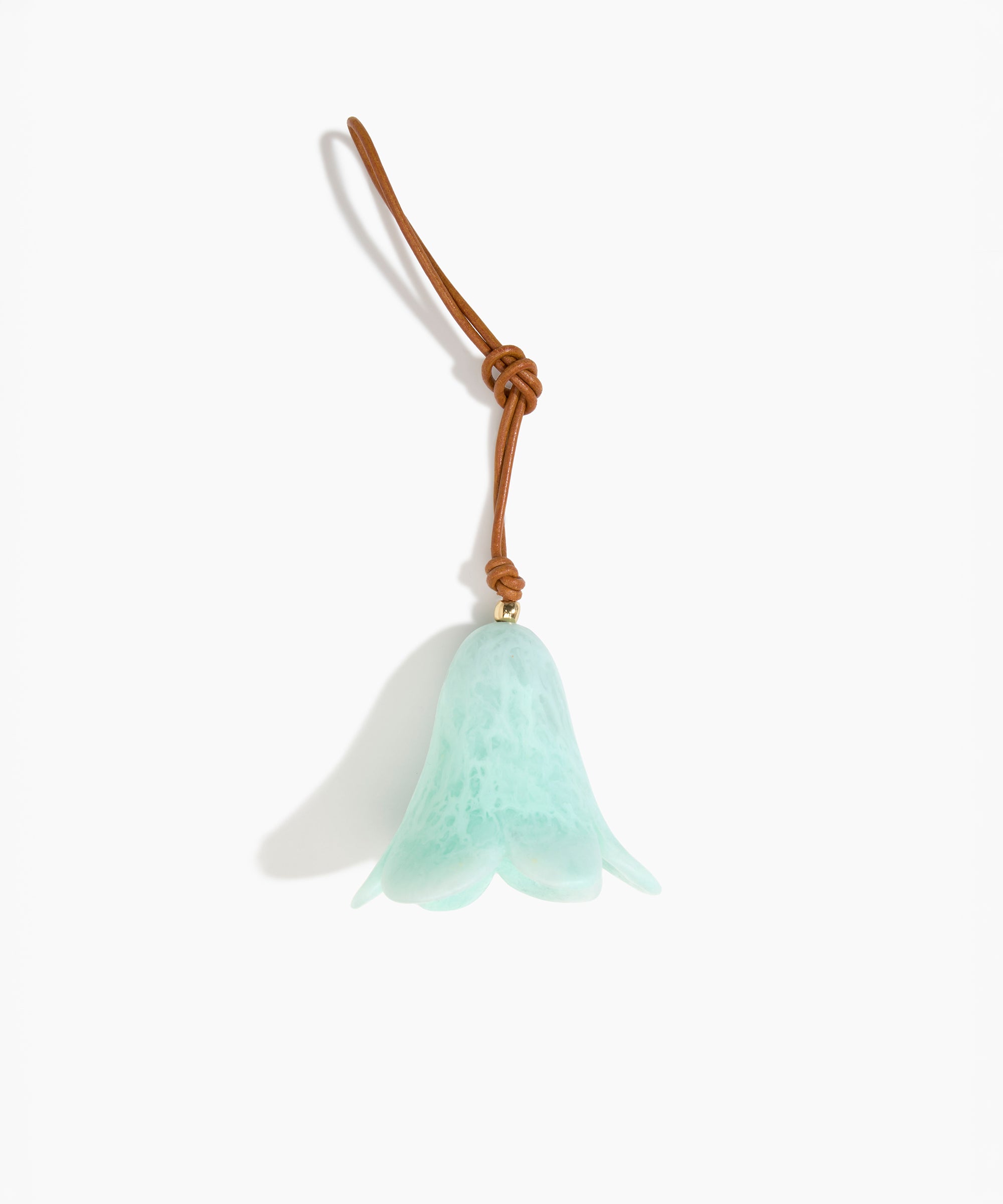 Dinosaur Designs Flower Decoration in Mint colour with Brass bead — handcrafted marbled mint blue resin bell-shaped flower ornament with tan leather hanging loop and brass bead