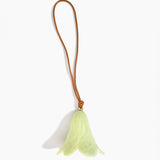Dinosaur Designs Flower Decoration in Pistachio colour with Brass bead — handcrafted marbled pastel green resin bell-shaped flower ornament with tan leather hanging loop and brass bead