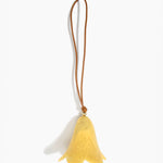 Dinosaur Designs Flower Decoration in Pollen colour with Brass bead — handcrafted marbled yellow resin bell-shaped flower ornament with tan leather hanging loop and brass bead