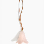 Dinosaur Designs Flower Decoration in Rose Swirl colour with Brass bead — handcrafted marbled dusty pink resin bell-shaped flower ornament with tan leather hanging loop and brass bead