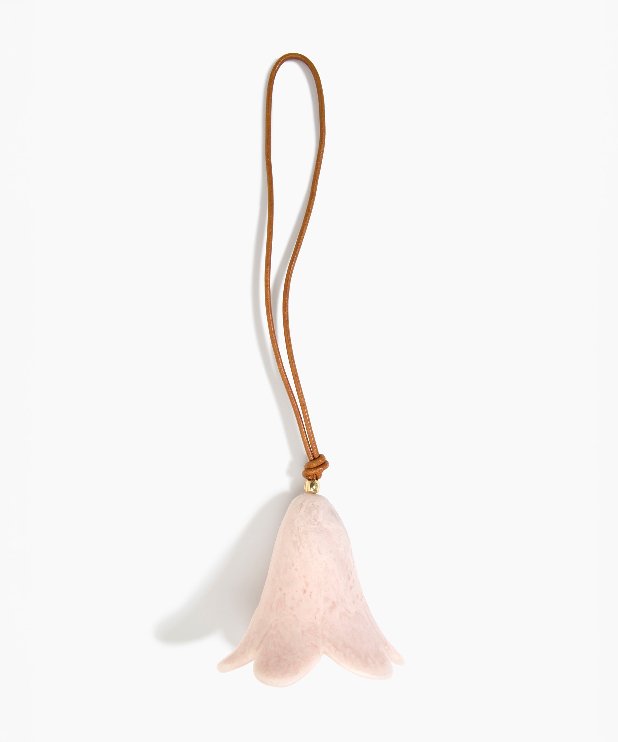 Dinosaur Designs Flower Decoration in Rose Swirl colour with Brass bead — handcrafted marbled dusty pink resin bell-shaped flower ornament with tan leather hanging loop and brass bead
