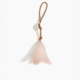 Dinosaur Designs Flower Decoration in Rose Swirl colour with Brass bead — handcrafted marbled dusty pink resin bell-shaped flower ornament with tan leather hanging loop and brass bead