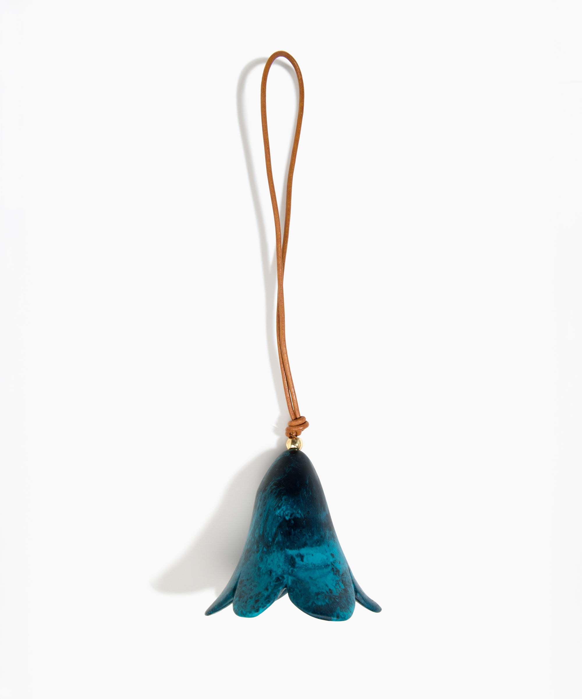 Dinosaur Designs Flower Decoration in Turquoise colour with Brass bead — handcrafted marbled teal blue resin bell-shaped flower ornament with tan leather hanging loop and brass bead