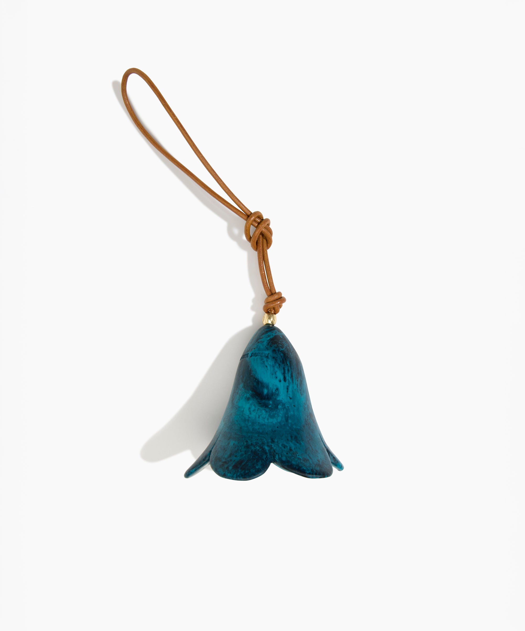 Dinosaur Designs Flower Decoration in Turquoise colour with Brass bead — handcrafted marbled teal blue resin bell-shaped flower ornament with tan leather hanging loop and brass bead