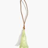 Dinosaur Designs Long Flower Decoration in Pistachio colour with Brass bead — handcrafted marbled pastel green resin bell-shaped flower ornament with tan leather hanging loop and brass bead