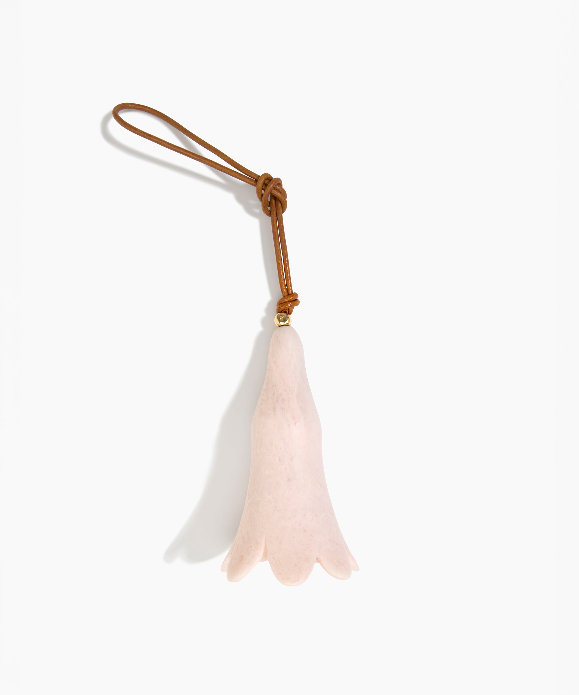 Dinosaur Designs Long Flower Decoration in Rose Swirl colour with Brass bead — handcrafted marbled dusty pink resin bell-shaped flower ornament with tan leather hanging loop and brass bead