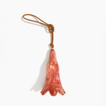 Dinosaur Designs Long Flower Decoration in Rust colour with Brass bead — handcrafted marbled terracotta red and cream resin bell-shaped flower ornament with tan leather hanging loop and brass bead