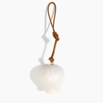 Dinosaur Designs Gumnut Decoration in Chalk Swirl colour with Brass hardware — handcrafted marbled off-white resin gumnut-shaped ornament with tan leather hanging loop and brass bead