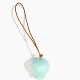 Dinosaur Designs Gumnut Decoration in Mint colour with Brass hardware — handcrafted marbled mint blue resin gumnut-shaped ornament with tan leather hanging loop and brass bead