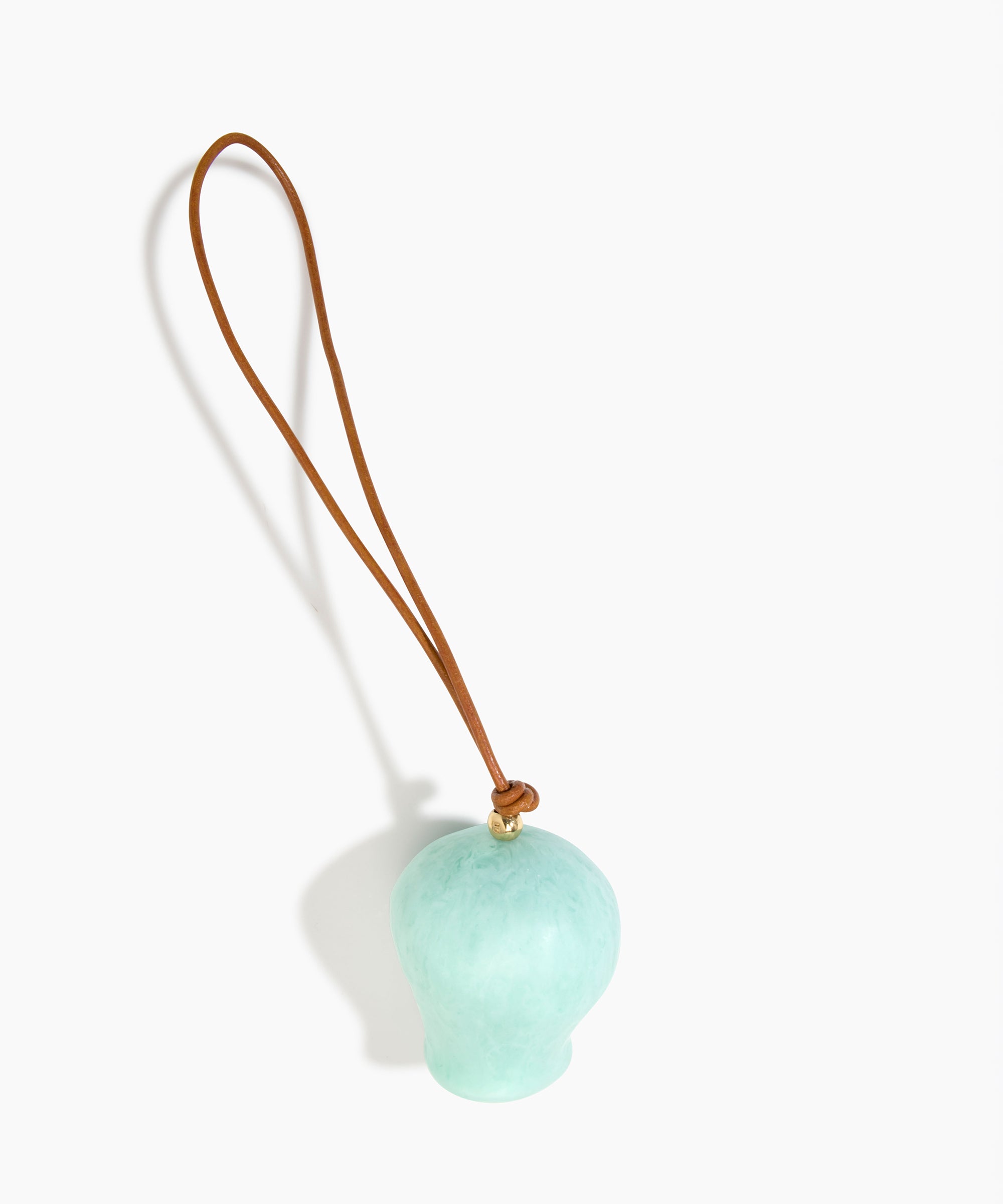 Dinosaur Designs Gumnut Decoration in Mint colour with Brass hardware — handcrafted marbled mint blue resin gumnut-shaped ornament with tan leather hanging loop and brass bead