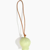 Dinosaur Designs Gumnut Decoration in Pistachio colour with Brass hardware — handcrafted marbled pastel green resin gumnut-shaped ornament with tan leather hanging loop and brass bead
