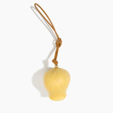Dinosaur Designs Gumnut Decoration in Pollen colour with Brass hardware — handcrafted marbled yellow resin gumnut-shaped ornament with tan leather hanging loop and brass bead