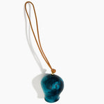 Dinosaur Designs Gumnut Decoration in Turquoise colour with Brass hardware — handcrafted marbled teal blue resin gumnut-shaped ornament with tan leather hanging loop and brass bead