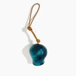 Dinosaur Designs Gumnut Decoration in Turquoise colour with Brass hardware — handcrafted marbled teal blue resin gumnut-shaped ornament with tan leather hanging loop and brass bead
