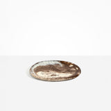 Dinosaur Designs Rock Plate in Cappuccino — handcrafted marbled brown and cream resin oval flat serving plate with rounded organic edge..