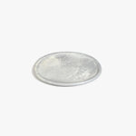 Dinosaur Designs Rock Plate in Cloud — handcrafted marbled grey and cream resin oval flat serving plate with rounded organic edge..