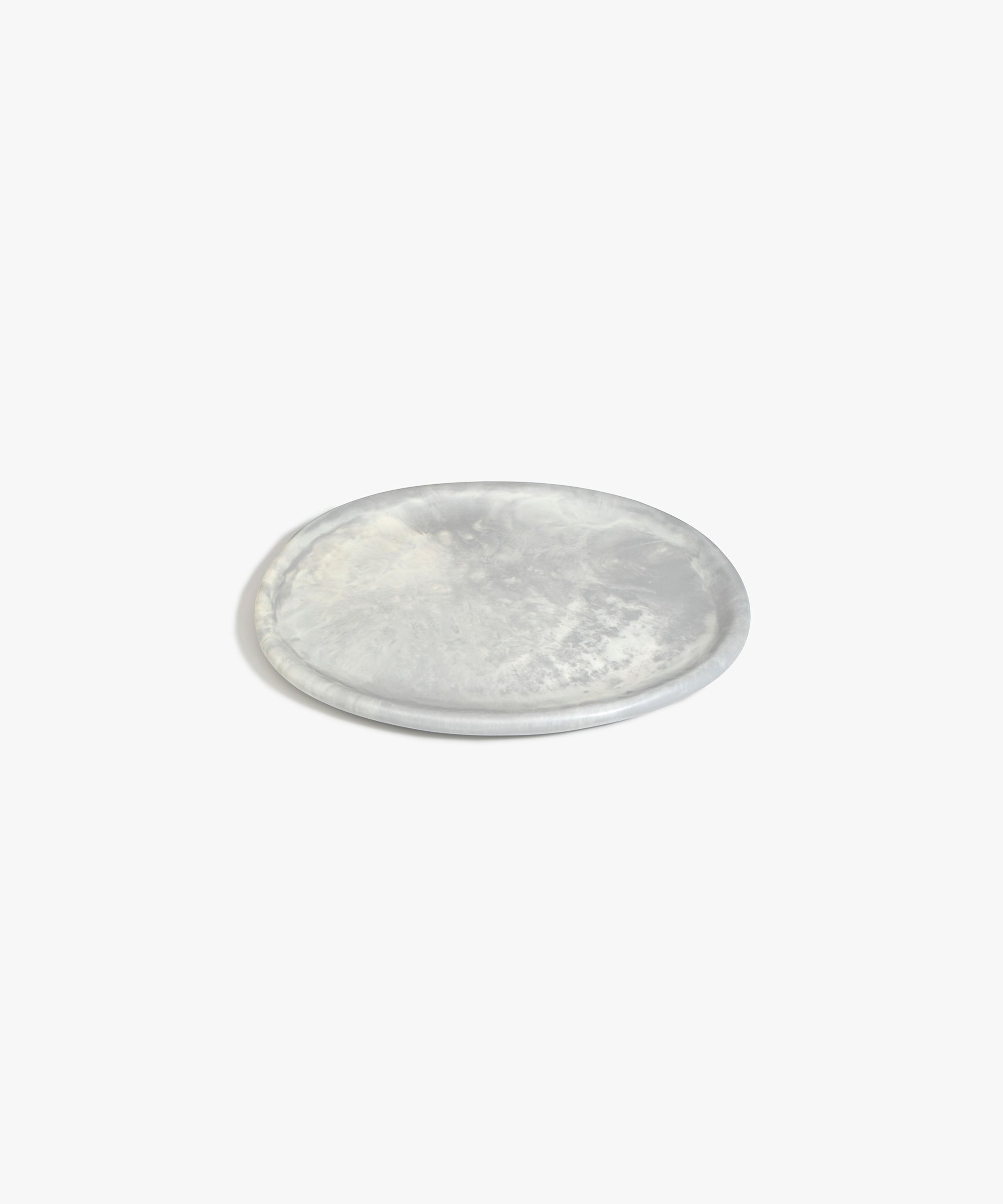 Dinosaur Designs Rock Plate in Cloud — handcrafted marbled grey and cream resin oval flat serving plate with rounded organic edge..