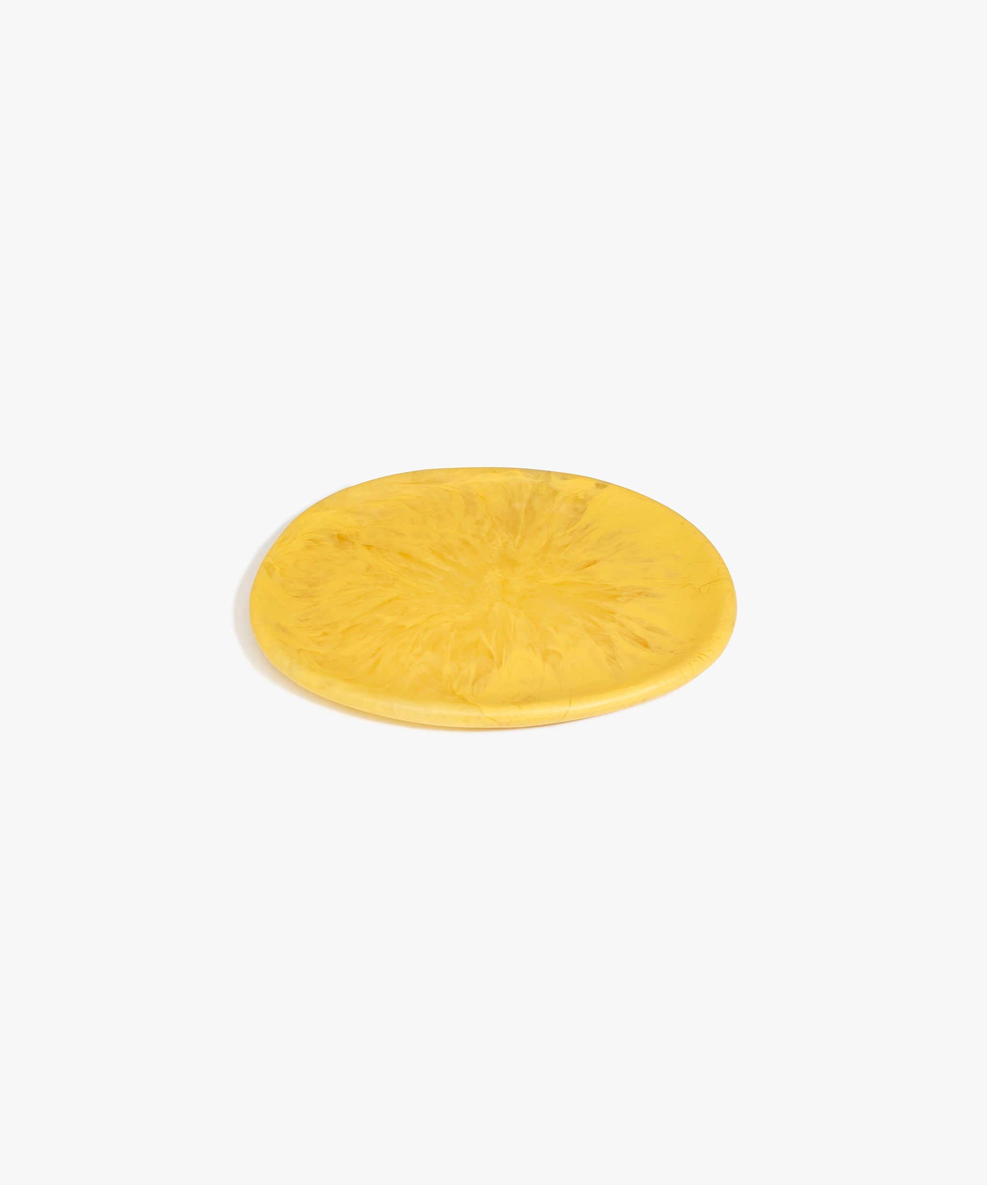 Dinosaur Designs Rock Plate in Pollen — handcrafted marbled yellow resin oval flat serving plate with rounded organic edge