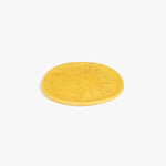 Dinosaur Designs Rock Plate in Pollen — handcrafted marbled yellow resin oval flat serving plate with rounded organic edge..