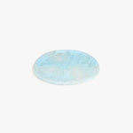 Dinosaur Designs Rock Plate in Pool — handcrafted marbled blue resin oval flat serving plate with rounded organic edge..