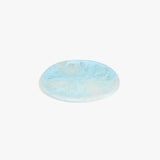 Dinosaur Designs Rock Plate in Pool — handcrafted marbled blue resin oval flat serving plate with rounded organic edge..