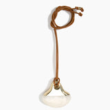 Dinosaur Designs Large Polished Lotus Pendant on Leather in Chalk Swirl with Brass hardware — marbled off-white resin half-crescent pendant with polished brass setting on an adjustable tan leather cord