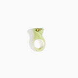 Dinosaur Designs Long Lily Ring in Pistachio — handcrafted marbled pastel green resin ring with sculptural swirled flower and brass bead