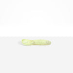 Dinosaur Designs Shell Gelato Scoop in Pistachio — handcrafted marbled pale green resin ice cream scoop with deep rounded bowl and smooth cylindrical handle