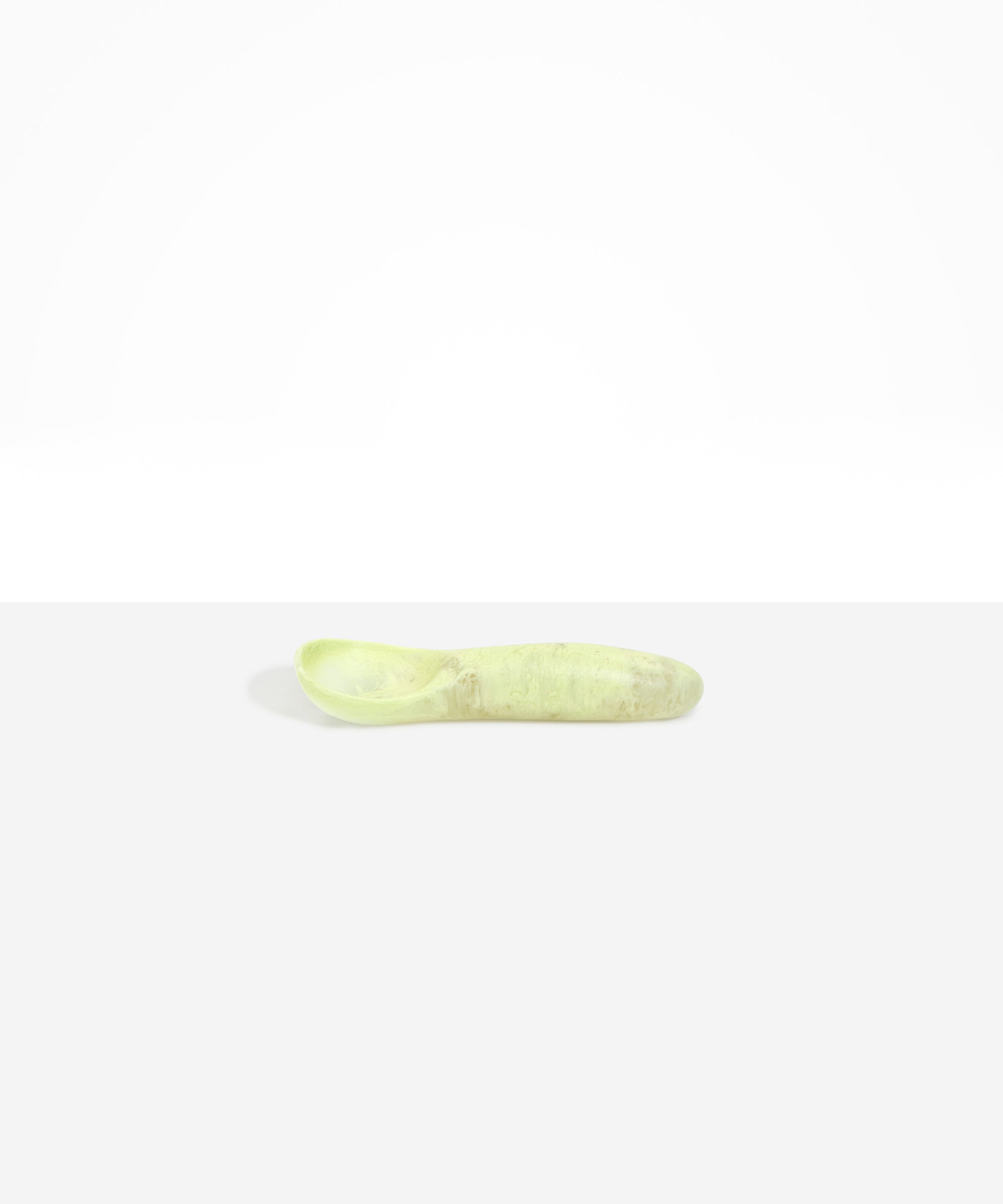 Dinosaur Designs Shell Gelato Scoop in Pistachio — handcrafted marbled pale green resin ice cream scoop with deep rounded bowl and smooth cylindrical handle