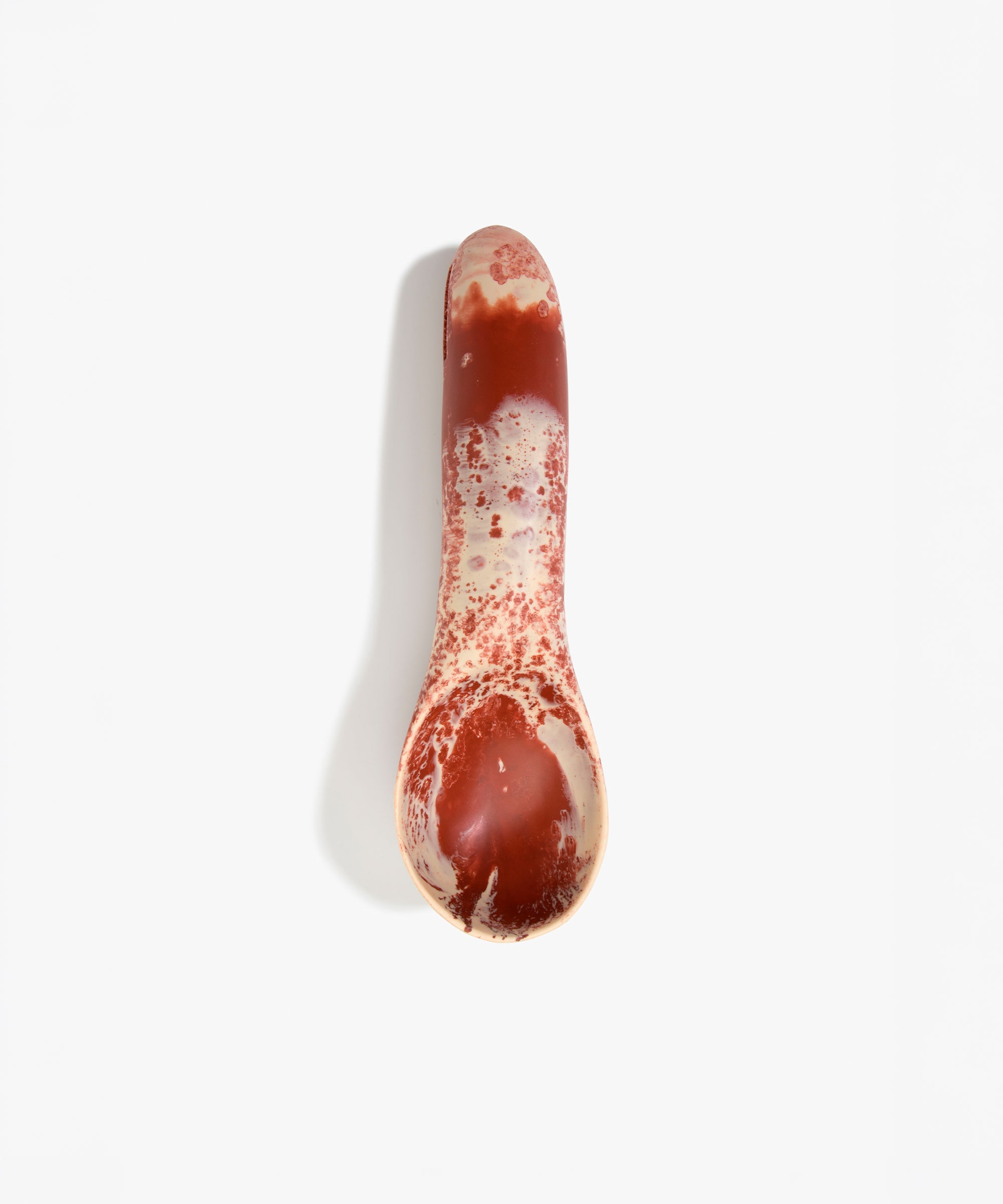 Dinosaur Designs Shell Gelato Scoop in Rust — handcrafted marbled terracotta red and cream resin ice cream scoop with deep rounded bowl and smooth cylindrical handle