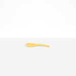 Dinosaur Designs Large Shell Spoon in Pollen — handcrafted marbled yellow resin spoon with slender tapered handle