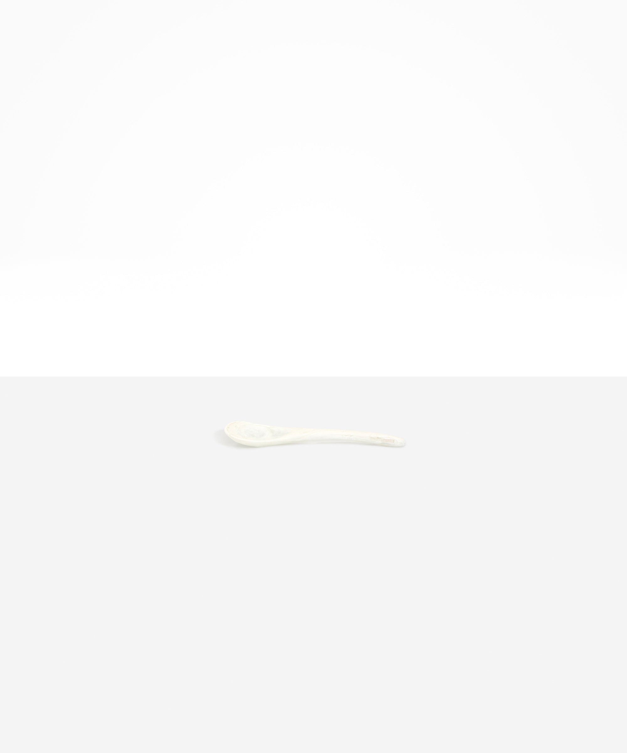 Dinosaur Designs Medium Shell Spoon in Chalk Swirl — handcrafted marbled off-white resin spoon with slender tapered handle