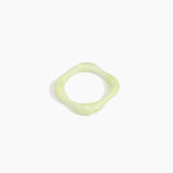 Dinosaur Designs Petal Bangle in Pistachio — handmade marbled pastel green resin bangle with slim undulating organic form