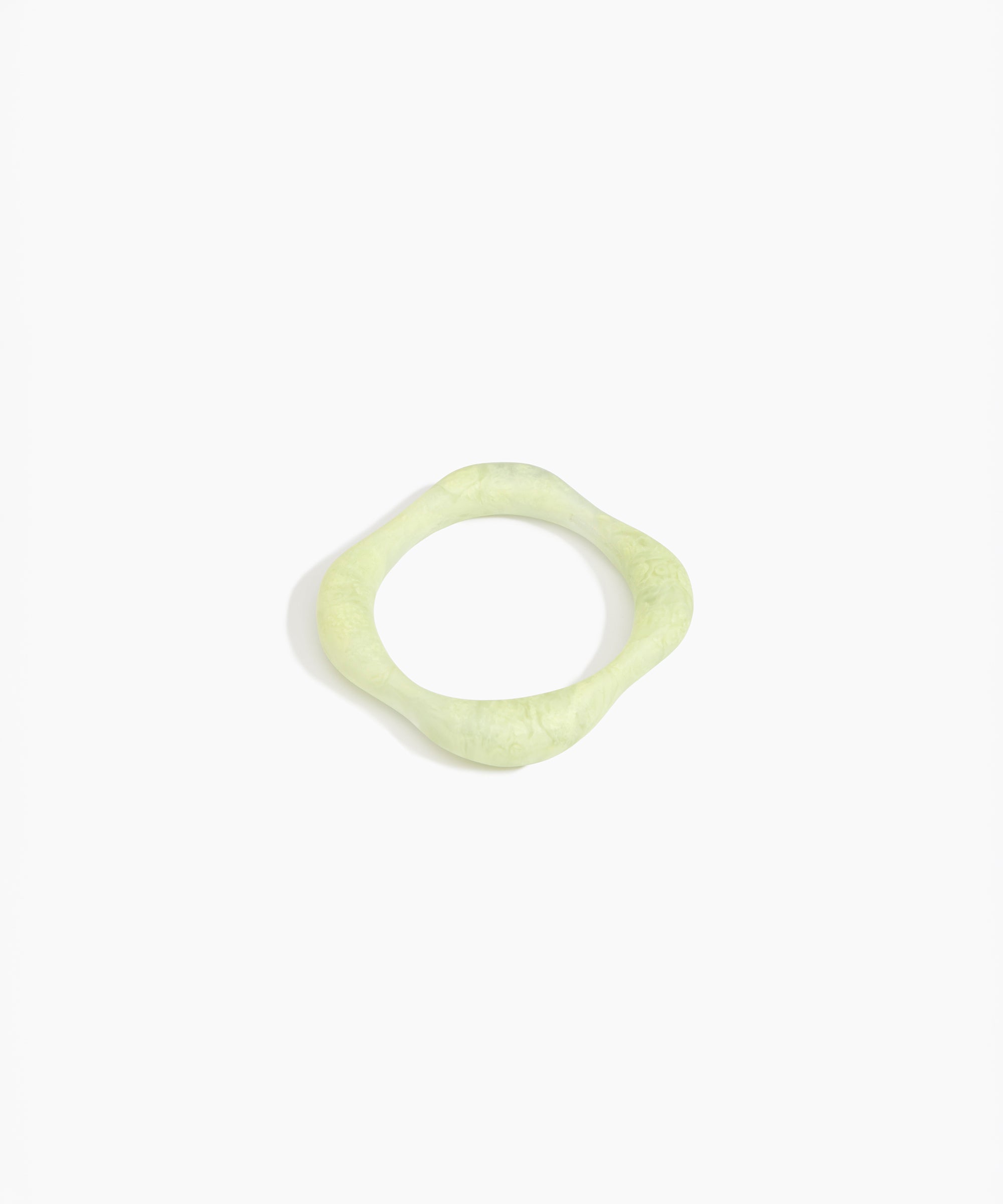 Dinosaur Designs Petal Bangle in Pistachio — handmade marbled pastel green resin bangle with slim undulating organic form