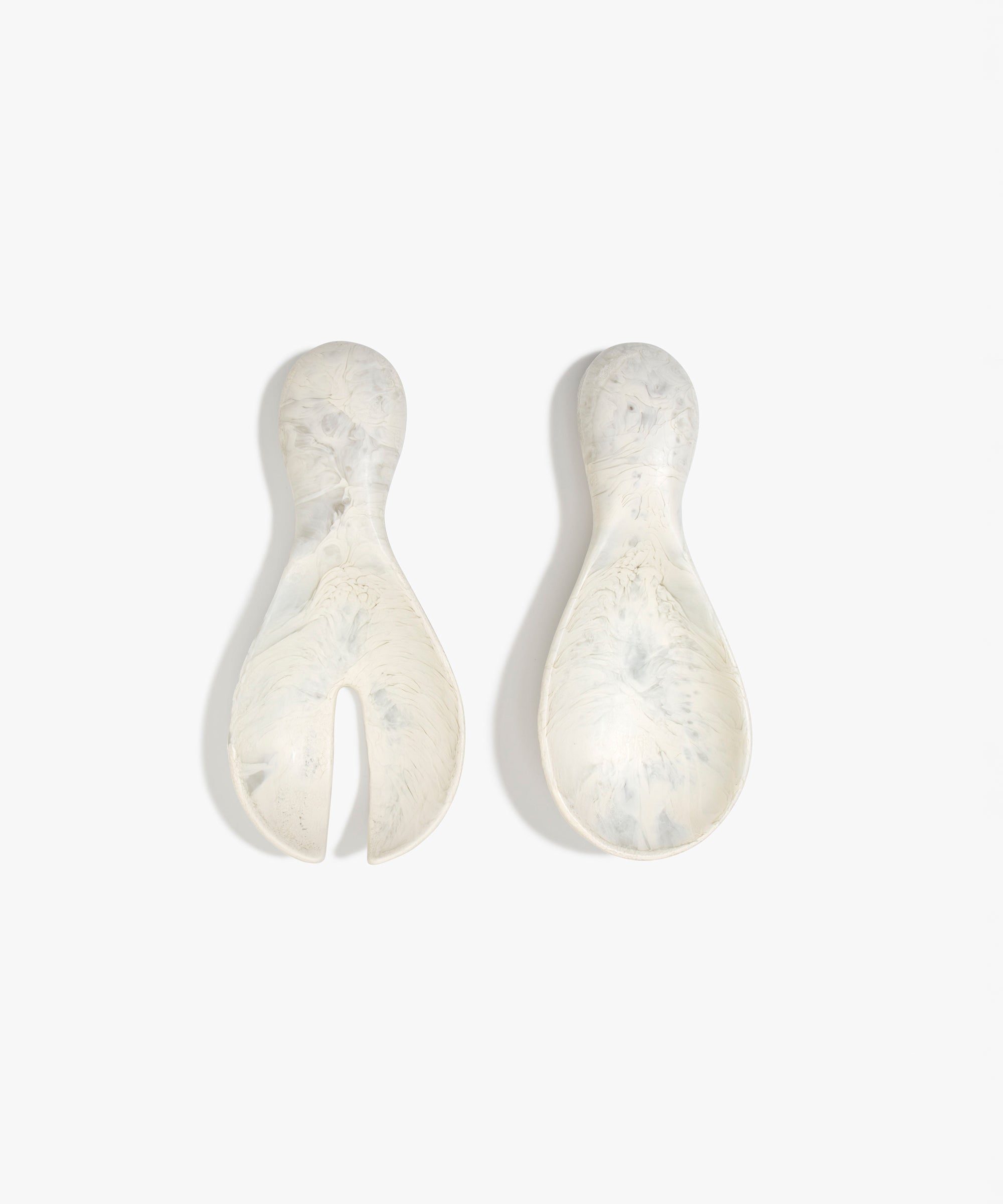 Dinosaur Designs Rock Servers in Chalk Swirl — handcrafted marbled off-white resin salad server set with rounded bulb handles, fork and spoon.