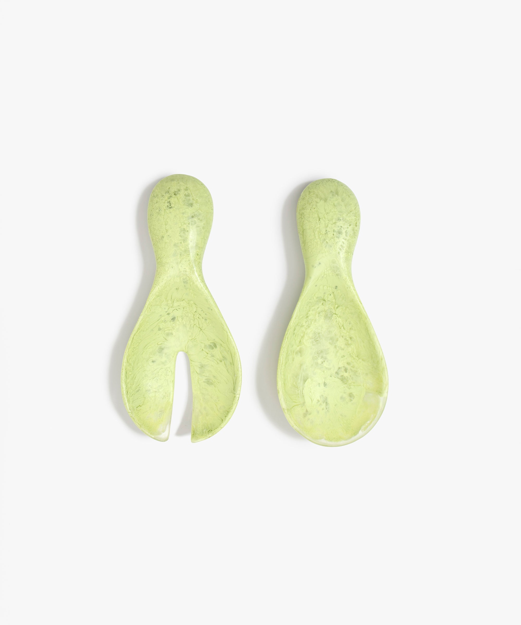 Dinosaur Designs Rock Servers in Pistachio — handcrafted marbled pale green resin salad server set with rounded bulb handles, fork and spoon.