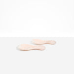 Dinosaur Designs Rock Servers in Rose Swirl — handcrafted marbled dusty pink resin salad server set with rounded bulb handles, fork and spoon.