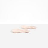 Dinosaur Designs Rock Servers in Rose Swirl — handcrafted marbled dusty pink resin salad server set with rounded bulb handles, fork and spoon.